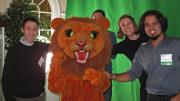 Graduate students pose with the Dudley Lion mascot.