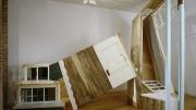 Meredith James created her 14 x 8 x 12-foot sculpture <i>Impossible House</i> with salvaged wood and windows.