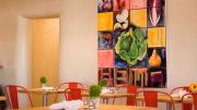Vinaigrette’s light, airy interior pays artistic homage on one wall to the building blocks of salads.