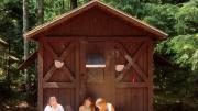 Campers outside one of the two-person cabins they call home