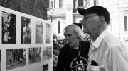 Peter Winship (left) and Bill Christian examine photographs recalling their days as student researchers in the village of Chanzeaux, under the tutelage of the late Laurence Wylie.