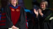 Harvard president Drew Faust, right, stands as Clayton Spencer is introduced as the eighth president of Bates College on October 26, 2012.