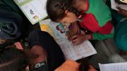 Photograph by Peter Pereira Even those who don't attend school can come to the center for basic literacy education.