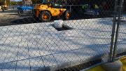 15. From the western edge of the plaza space, new surface pavers, finished with an aggregate of crushed, recycled porcelain, were being installed, with spaces for permanent seating to come during a later phase of the construction.