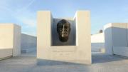 An enlarged version of the famous bronze bust of Roosevelt created by American sculptor Jo Davidson appears at the threshold of a square, white-granite, open-air plaza.