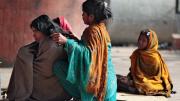 Many families make their homes on sidewalks near the train station in Jaipur, India.