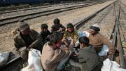 Photograph by Peter Pereira It's a hard life for boys who fall into this livelihood. They socialize with older men, gambling to pass the time between trains and using drugs to ease the shame of poverty and the pain of hunger and cold.
