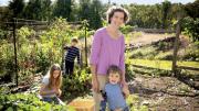 Zoe Resch with her children (clockwise from left) Prairie (9), Silas (7), and Calder (3) in their family vegetable garden in Vermont 