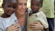 At left, Betancourt with young friends Binta and Christopher in Koidu Town, Kono District, Sierra Leone.