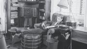 A 1940s undergraduate listens to records in his suite. 