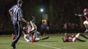 Safety Jaron Wilson dove into the end zone, vaulting over Bruin halfback Andrew Coke, to finish off a 51-yard interception return in the Brown game. Cornerback Brian Owusu (6, at right) had thrown a crushing block on Coke just in front of the goal line. 