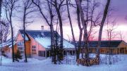 Maine Huts &amp; Trails offers winter sunsets in the wilderness (along with food, hot showers, and convivial company) at the Stratton Brook Hut. 