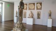 Natural daylight accentuates the materials of the sculptures—marble, sandstone, lingering traces of colored pigments and gold decorations—in one of the museums’ galleries of Buddhist art.