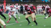 Linebacker Eric Medes ’16 (49), here picking off a second-quarter pass and returning it 12 yards, was a mainstay of a Crimson defense that held the Big Red at bay until the offense could get in gear.
