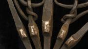 Faces appear on part of an iron axe (Zaire)