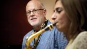 John Payne teaches a saxophone student at his music center in Brookline, Massachusetts.
