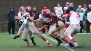 Under the watchful gaze of Langston Ward ’17 (number 92), defensive tackle Jameson McShea ’16 (number 89) swallowed up Big Red quarterback Jake Jatis for his first career sack—one of four the Crimson had on the day.