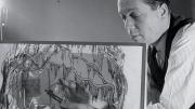 Award-winning set designer Jo Mielziner touches up a figurine for a set design executed on a glass pane in this January 1945 photograph.