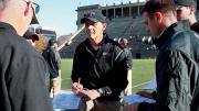 The year before, at the Stadium, Murphy consulted with his assistants before a 38-30 victory over Bagnoli and his Quakers.