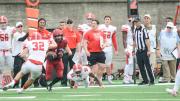 On one of his four receptions, Harvard's Joe Foster proved elusive for Big Red defenders DJ Woullard (31) and Daniel Crocher. 