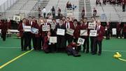 Band members display the signal cards for Harvard fight songs.