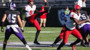 Harvard punter Sean McKeogh punts the ball