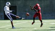 Harvard freshman Khalil Dawsey blocks the punt of Howard's Isaiah Moore.