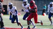 Harvard's DeMarkes Stradford zooms past Howard’s Ray Williams (7) and Deionte Davis (36). 