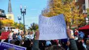 Supporters of affirmative action protest in Harvard Square. A poster reads, "Defend Diversity."