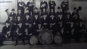An early group photo of Band members wearing bowler hats