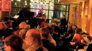 The Mad Monkfish's stage viewed from the back of a room