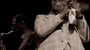 Photograph of jazz greats Dizzy Gillespie on trumpet and Dexter Gordon on tenor saxophone, circa 1976