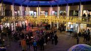 Bow Street’s festive courtyard lit up at night.