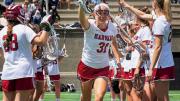 The Harvard women’s lacrosse team takes the field.