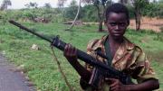 Photograph of a child soldier from Sierra Leone holding a self-loading rifle