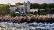 Majestic twentieth-century stone castle perched on Gloucester coastline