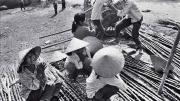 Black and white photo of street vendors, titled “Sugarcane Mongers”