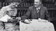 Black-and-white photograph of Karl Puchner in 1937 with his wife, young son, and a tiny, barely visible swastika button on his jacket