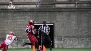 Harvard junior running back Aaron Shampklin eludes the desperate lunge of Cornell's Kenan Clarke to score the clinching touchdown.