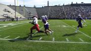 Kym Wimberly runs down the sideline with ball in hand.
