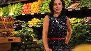 Emily Broad Leib in front of produce 