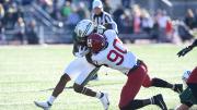 Harvard player Truman Jones defends agents Dartmouth runner Q Jones.