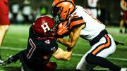 Harvard receiver Kaedyn Overman struggling for ball with Princeton defender Mason Armstead.