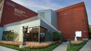 glass and steel addition to a traditional brick building that houses the Mattatuck Museum
