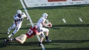 Photograph by Meredith Keffer Yale quarterback Patrick Witt, the Ivy League’s top passer, was sacked six times by Harvard defenders. End Ryan Burkhead ’11 (92) had a career-high 2.5 sacks for a net loss of 20 yards. The Eli behind Burkhead is running back Mordecai Cargill.