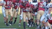 Junior tailback Treavor Scales was Harvard's top ground-gainer against Pennsylvania. His 70 yards rushing included a 35-yard breakaway, setting up a two-yard touchdown run (above) at the start of the final quarter. The Penn defender is linebacker Erik Rask.