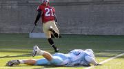 Damani Wilson's touchdown breakaways covered 45 and 43 yards. The   prostrate Lion defender is linebacker Zach Olinger. 