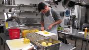 Last Friday, Pierre Hermé’s team of pastry chefs flew from France and set up shop in a Harvard kitchen, where they created four desserts that were served to the audience during the pastry chef’s lecture at the Graduate School of Design. Above, Peter Unger, a local chef who volunteered for the event, chops fruit for one of the desserts.