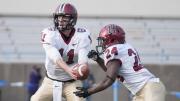 Freshman tailback Bo Ellis (24), shown taking a fourth-quarter handoff from backup quarterback Michael Pruneau, had 50 yards rushing on 14 carries at Columbia.