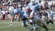 Strong defensive play held Columbia’s ground game to a net 49 yards rushing. Above, senior linebacker Matt Martindale (45) hauls down tailback Alan Watson. Martindale finished the game with five tackles and a quarterback sack.